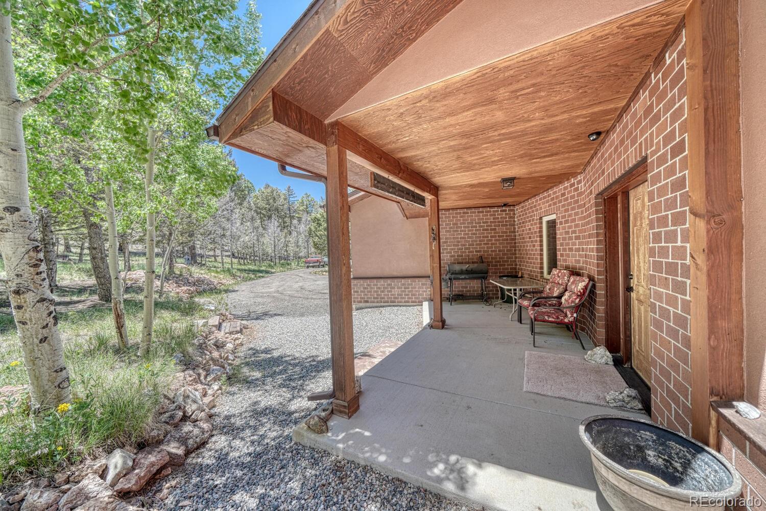 441 Kaufman Road Hartsel, CO 80449 - Photo 37 of 50 a backyard of a house with outdoor seating