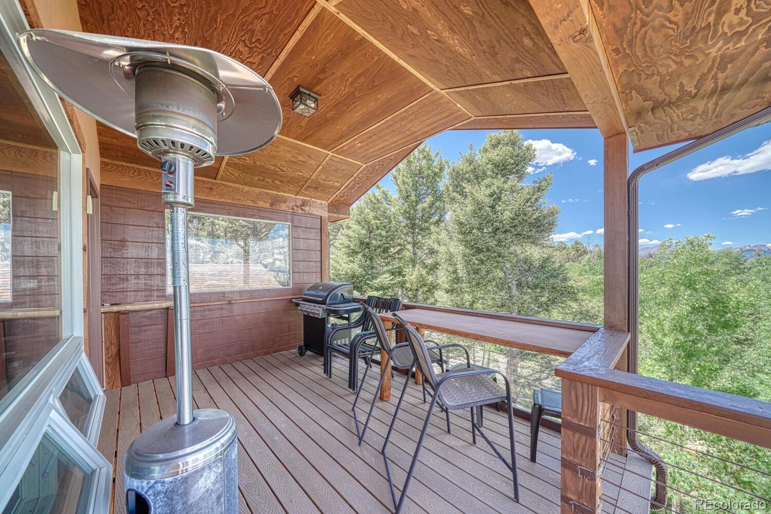 441 Kaufman Road Hartsel, CO 80449 - Photo 39 of 50 a patio with yard glass top table and chairs