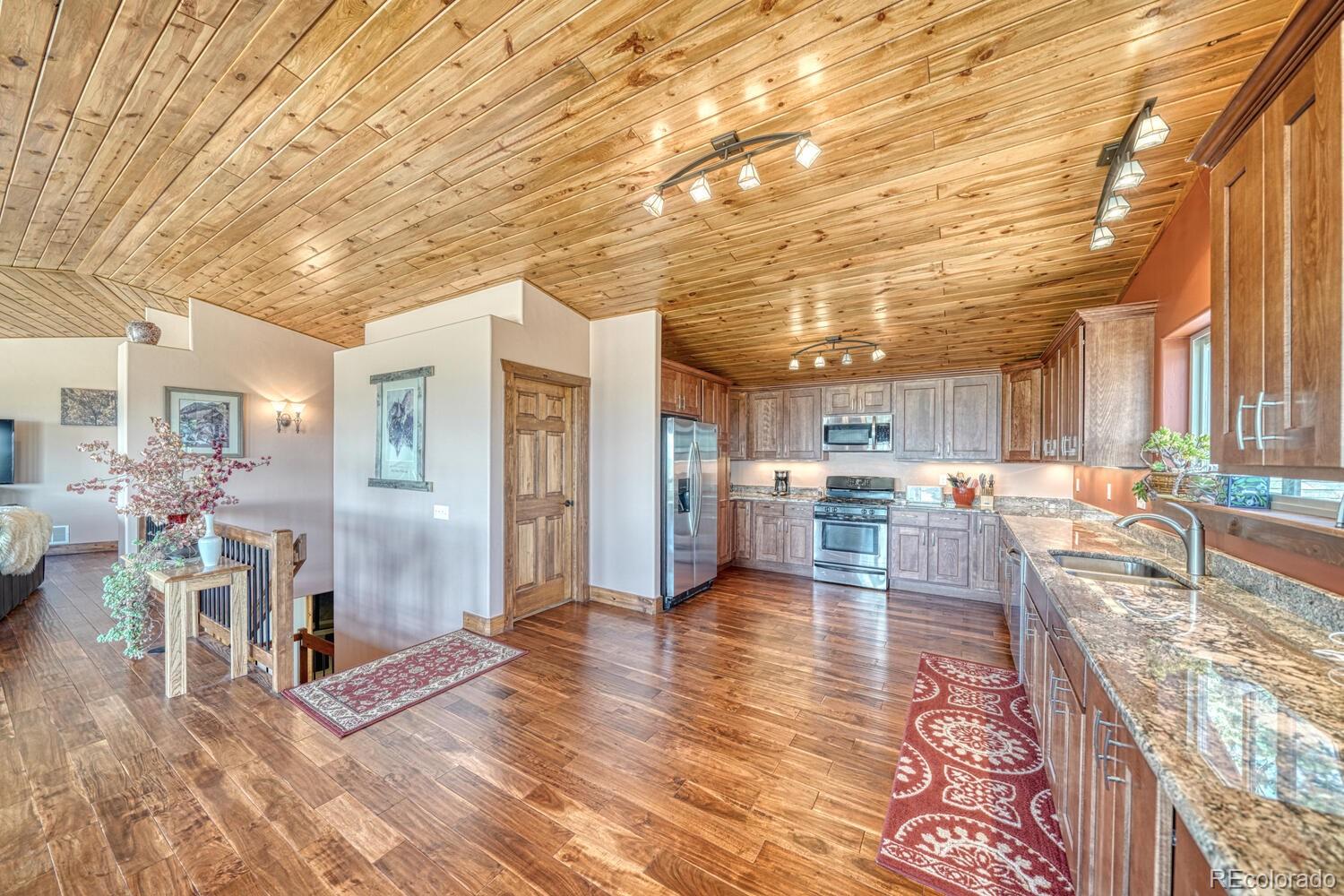 441 Kaufman Road Hartsel, CO 80449 - Photo 4 of 50 a living room with furniture and a wooden floor