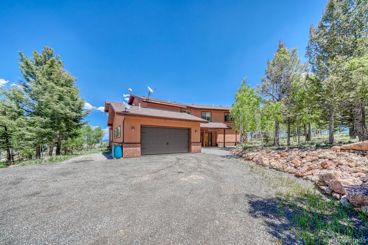 441 Kaufman Road Hartsel, CO 80449 - Photo 49 of 50 a view of a house with a yard and garage