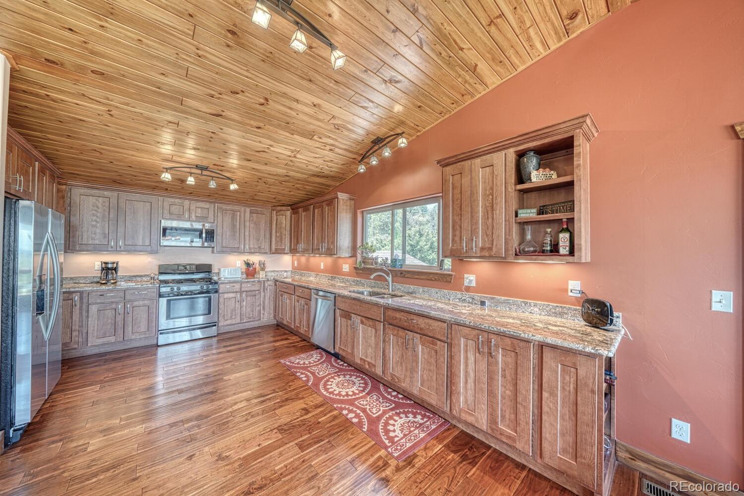 441 Kaufman Road Hartsel, CO 80449 - Photo 5 of 50 a kitchen with lots of counter top space and appliances