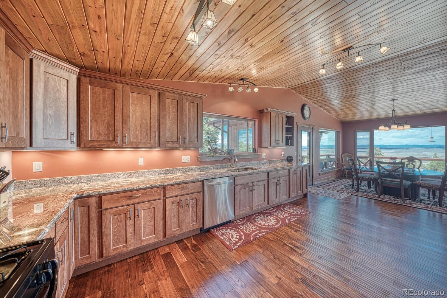 441 Kaufman Road Hartsel, CO 80449 - Photo 6 of 50 a kitchen with lots of counter top space and wooden floor