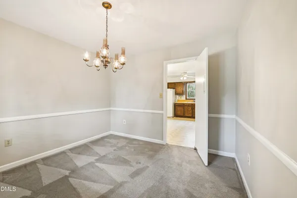 an empty room with windows and entrance
