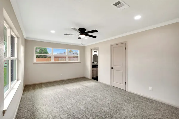 a view of an empty room with a bathroom