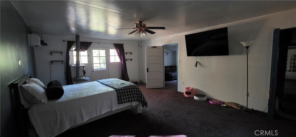 16455 French Town Road Brownsville, CA 95919 - Photo 19 of 26 a bedroom with a bed and a flat screen tv