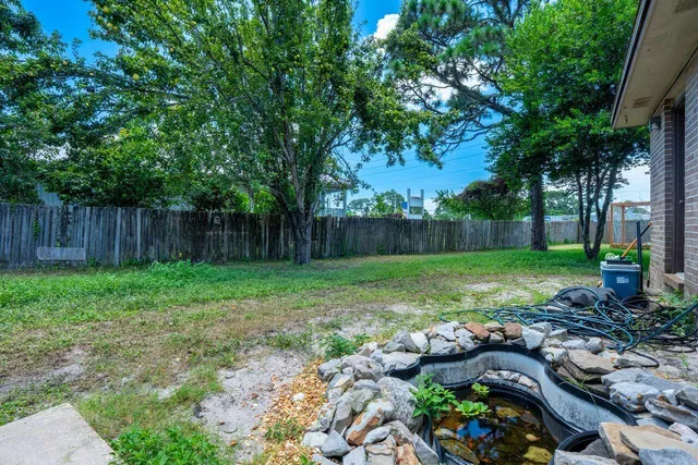a backyard of a house with lots of green space