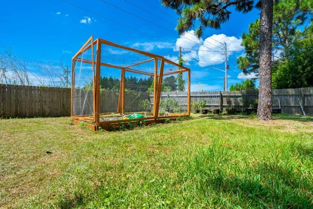 a view of a house with a backyard