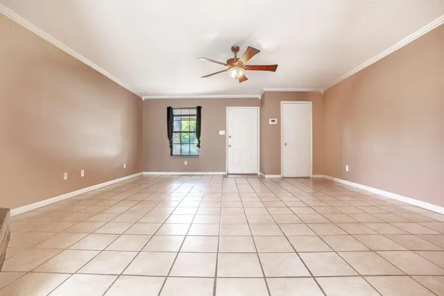 a view of an empty room and window