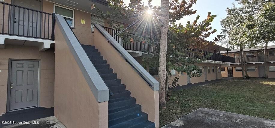 1713 Dixon Boulevard, Unit 158 Cocoa, FL 32922 - Photo 1 of 7 Stairs Leads to Front Door of condo