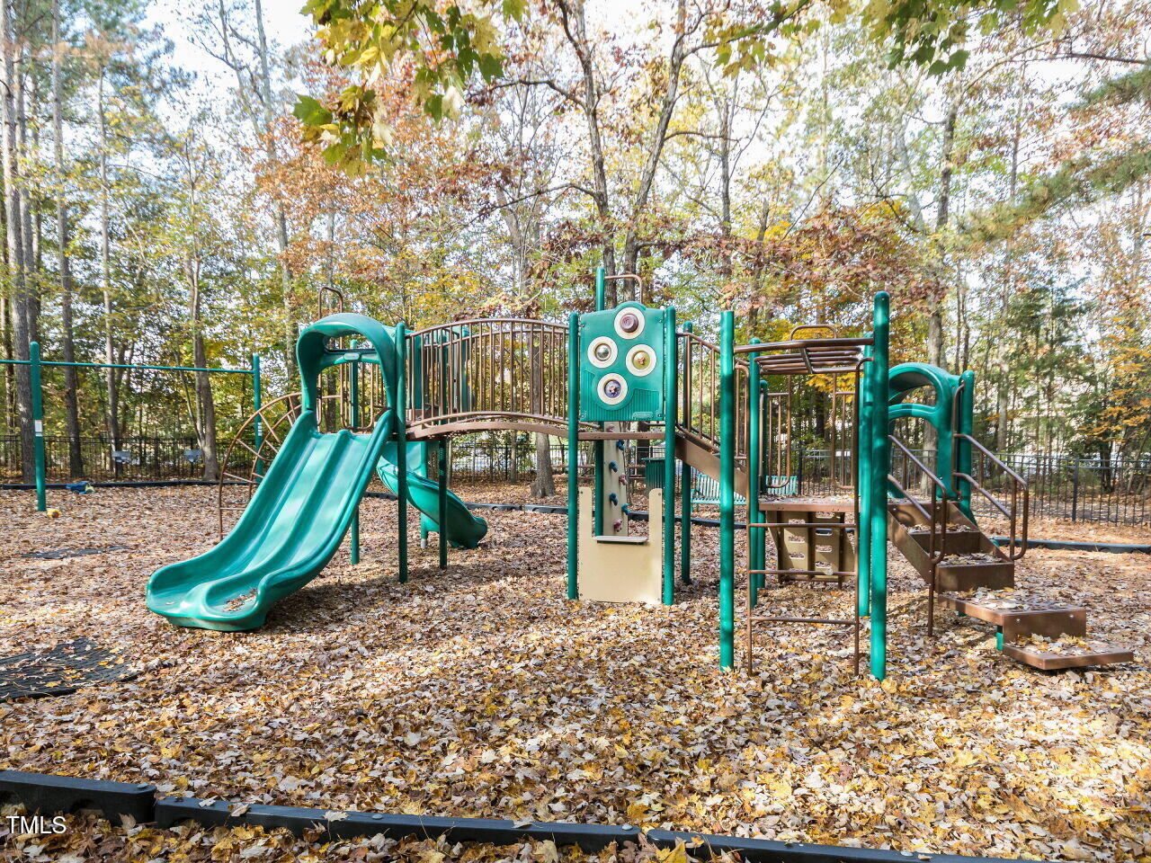 422 Colvard Woods Way Durham, NC 27713 - Photo 19 of 24 a childrens park with lots of swings slides and slide