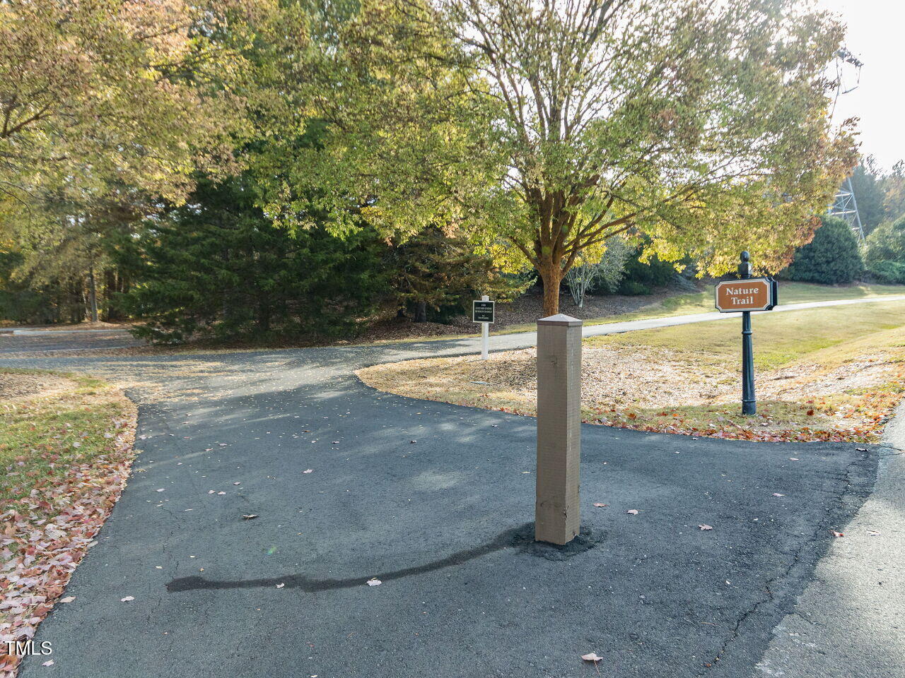 422 Colvard Woods Way Durham, NC 27713 - Photo 20 of 24 a view of a street with large trees