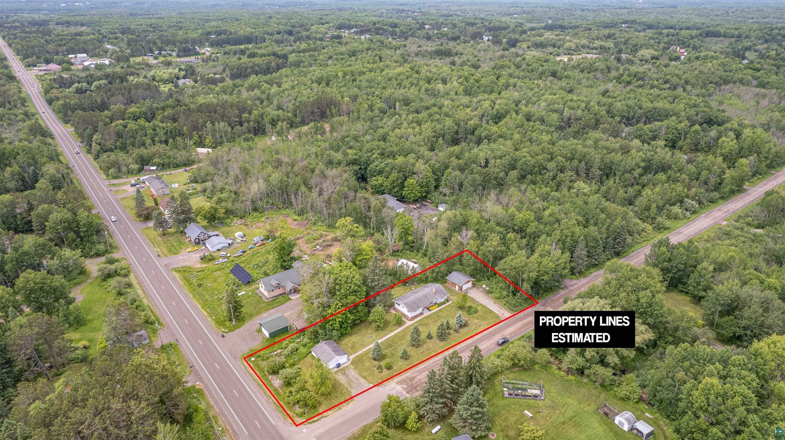 3711 Getchell Road Hermantown, MN 55811 - Photo 3 of 31 Aerial perspective showcasing a parcel with two structures, surrounded by mature trees