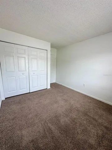 a view of an empty room and entryway