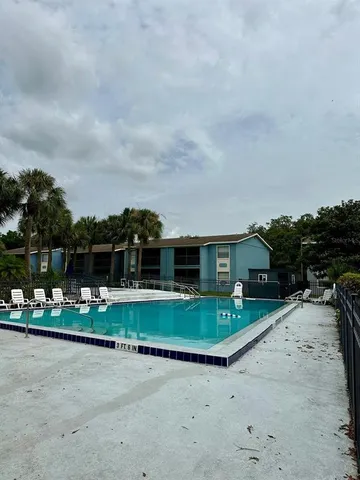 a front view of house with a yard and garage