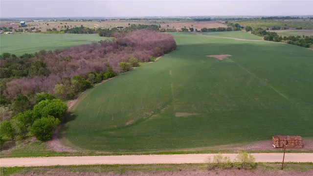 a view of a lake with a yard
