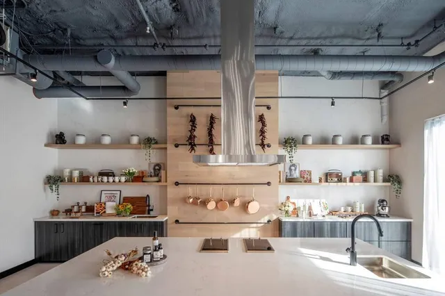 a kitchen with a stove and cabinets