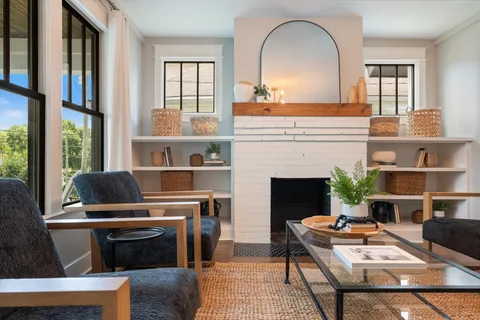 a kitchen with stainless steel appliances white cabinets and a window