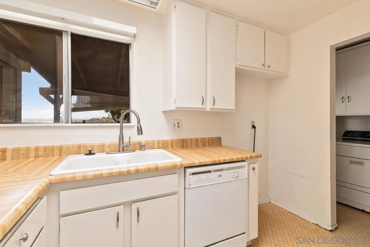 1360 Panorama Ridge Road Oceanside, CA 92056 - Photo 4 of 13 a kitchen with a sink and cabinets