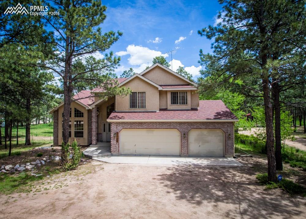 11985 Windmill Road Colorado Springs, CO 80908 - Photo 1 of 4 Front view of this stunning home!