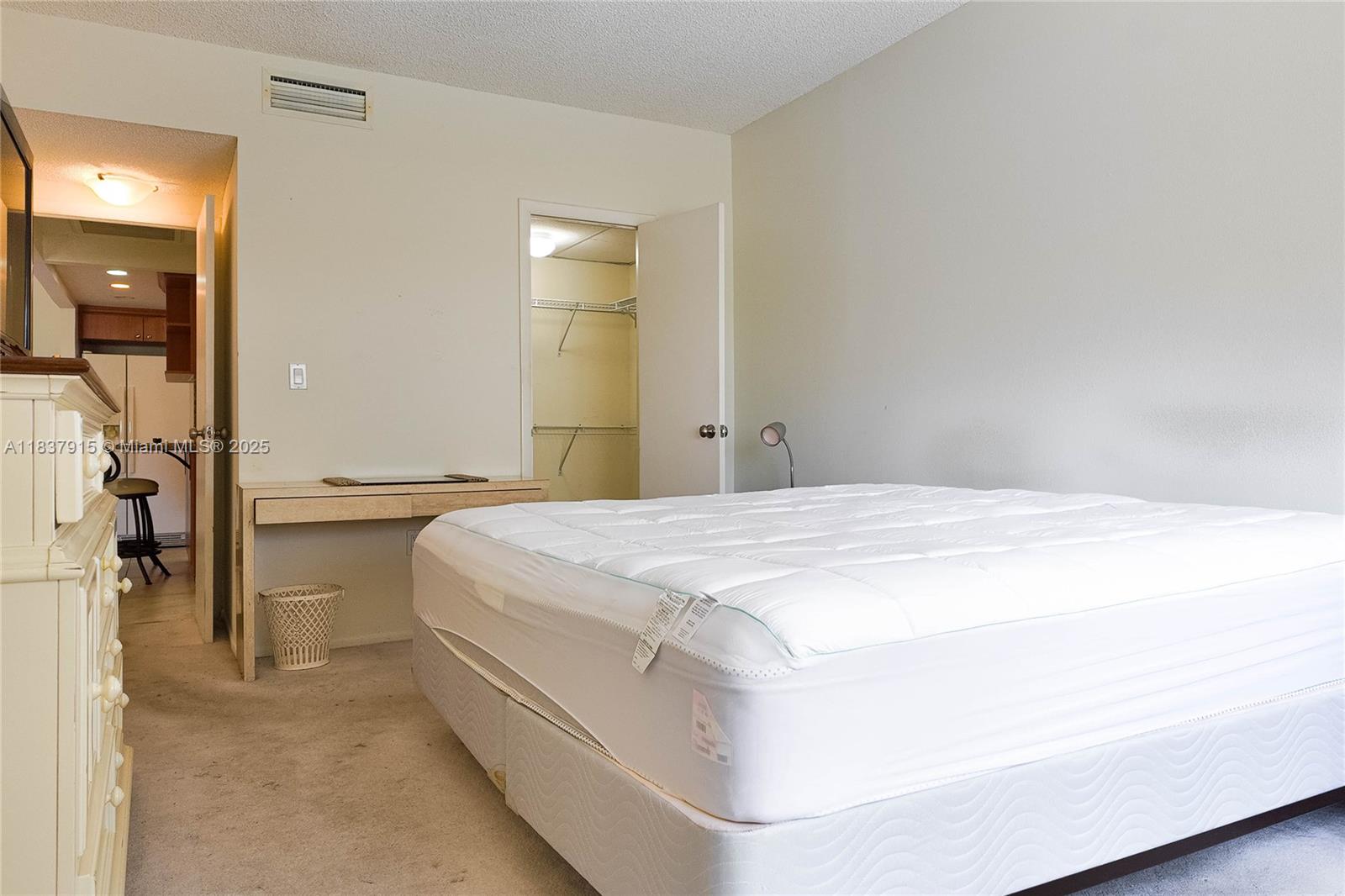 1980 South Ocean Drive, Unit 3A Hallandale Beach, FL 33009 - Photo 11 of 21 a spacious bedroom with a bed and a mirror