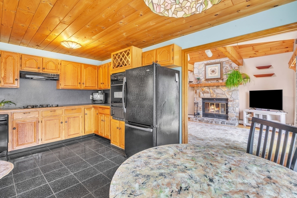 15 Sherman Hill Road Ware, MA 01082 - Photo 5 of 30 a kitchen with stainless steel appliances a refrigerator and a stove
