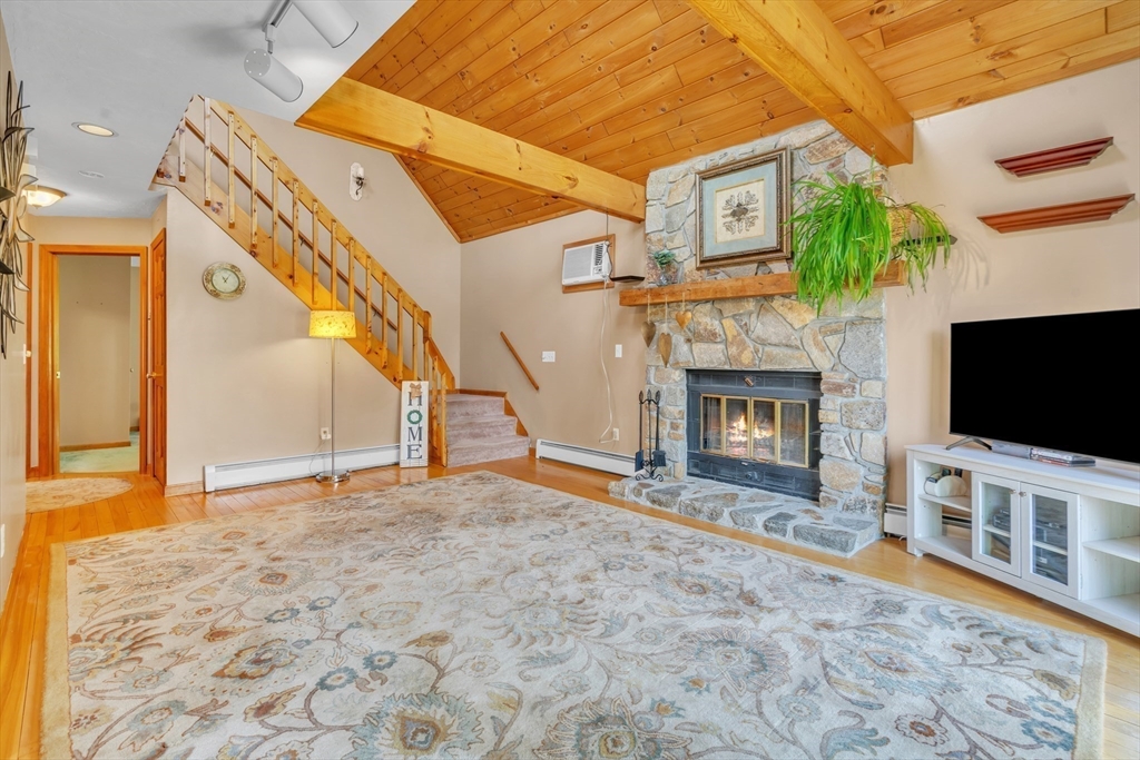 15 Sherman Hill Road Ware, MA 01082 - Photo 7 of 30 a view of a livingroom with a flat tv screen and a fireplace