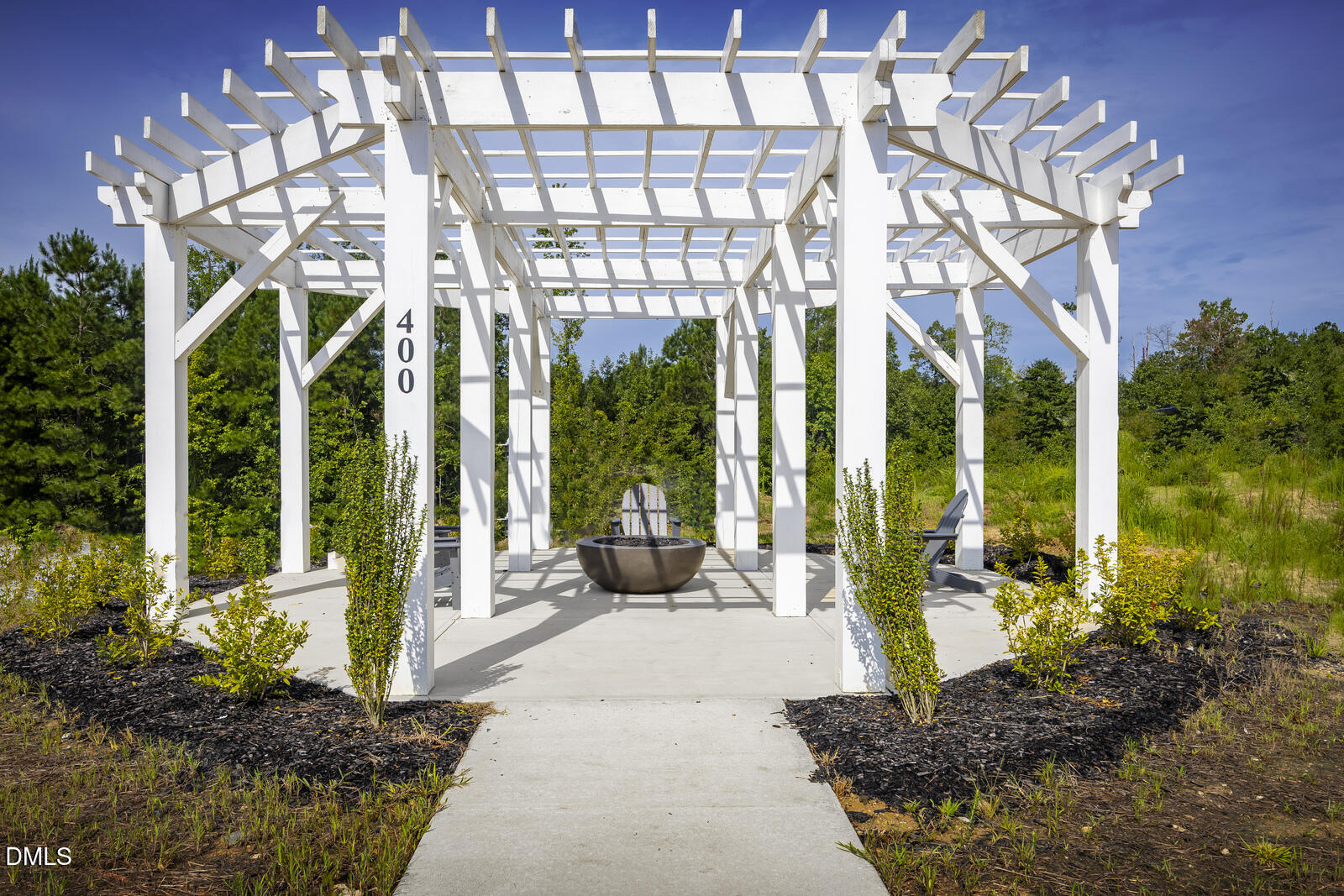1237 Rollman Farm Road Raleigh, NC 27603 - Photo 23 of 24 a view of a building with a garden