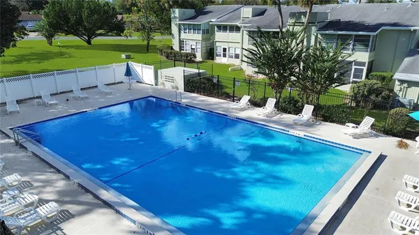 a view of a pool with a patio