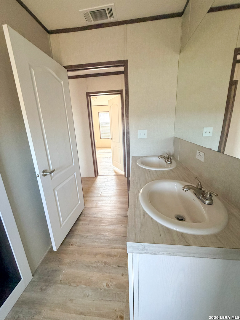 309 Jackson Refugio, TX 78377 - Photo 13 of 14 a bathroom with a sink and a mirror