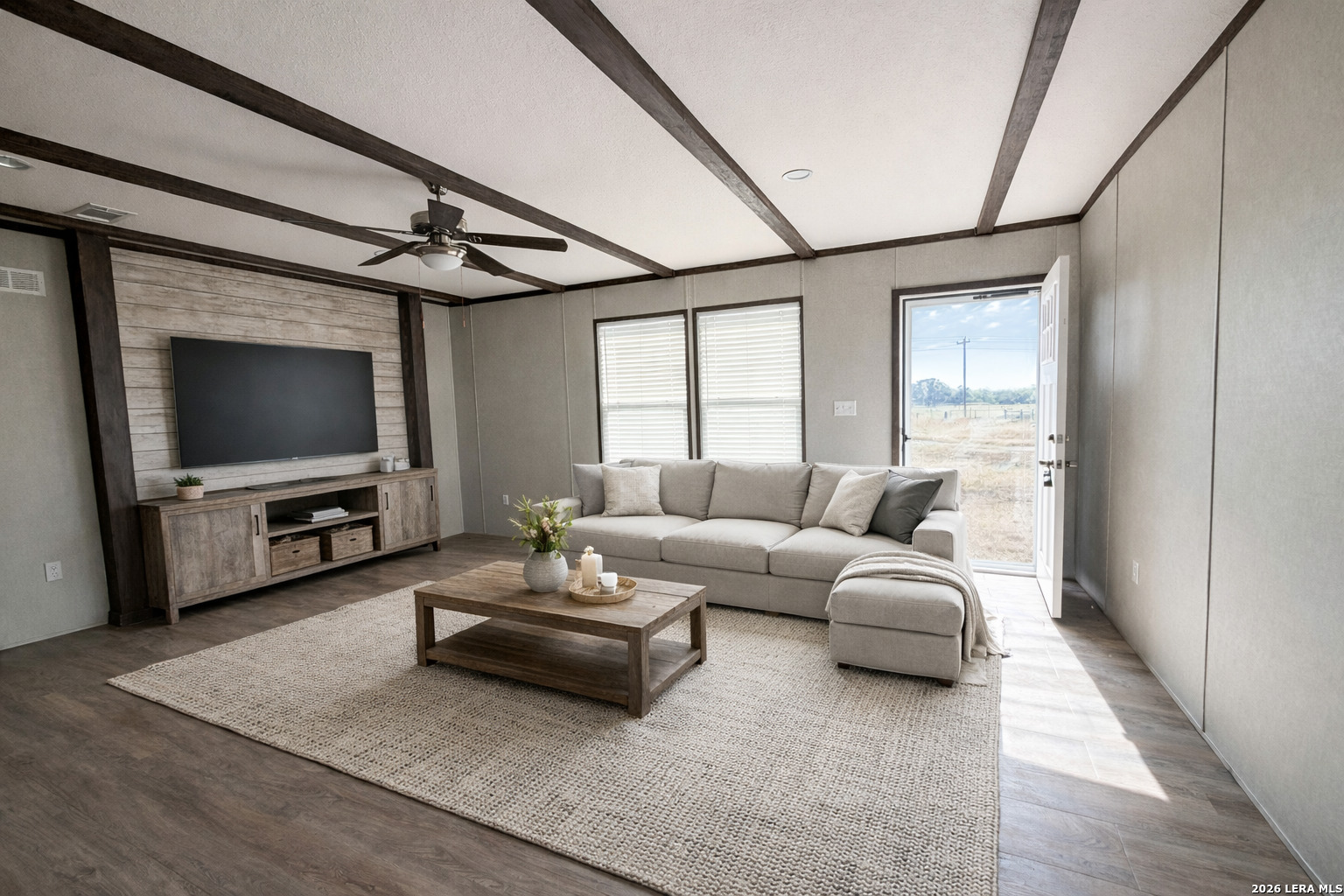 309 Jackson Refugio, TX 78377 - Photo 2 of 14 a living room with furniture and a flat screen tv