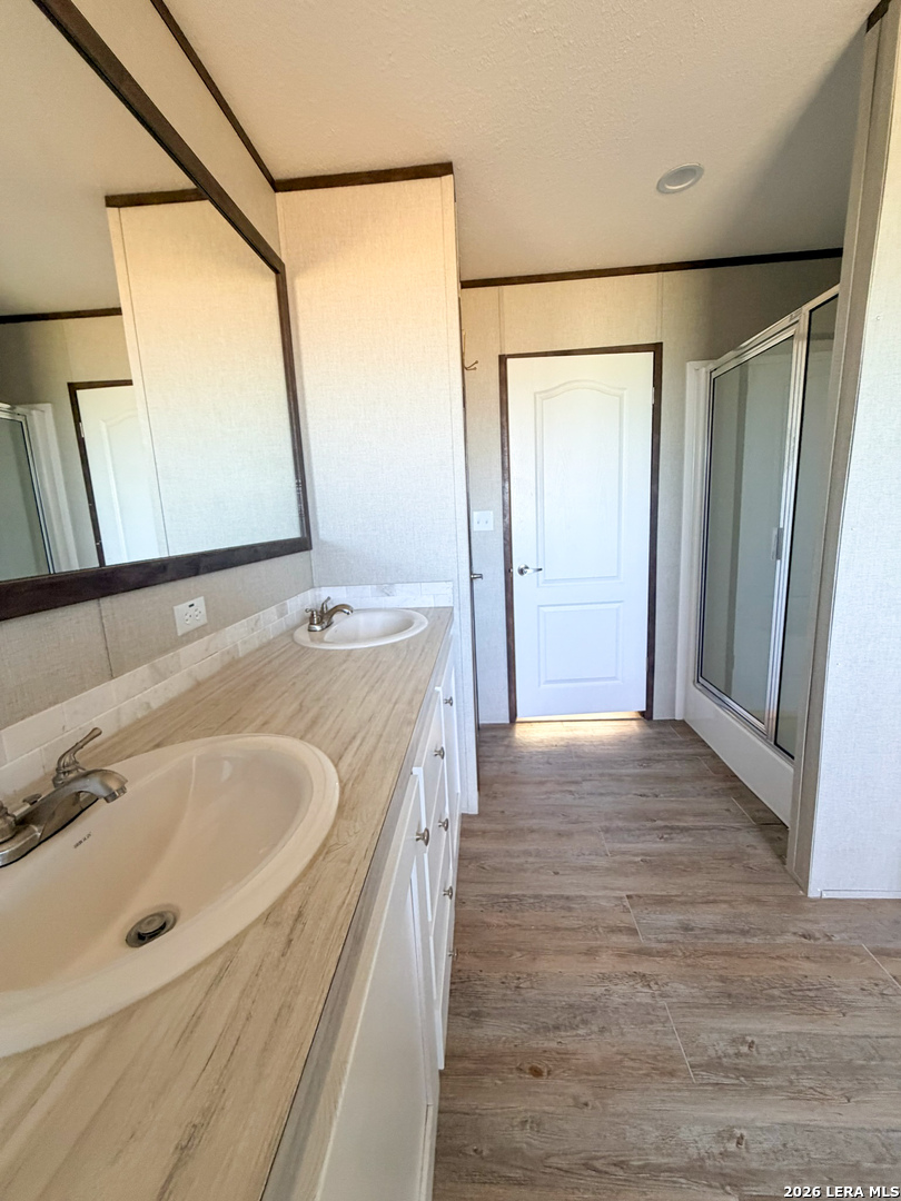 309 Jackson Refugio, TX 78377 - Photo 8 of 14 a bathroom with a tub sink and mirror