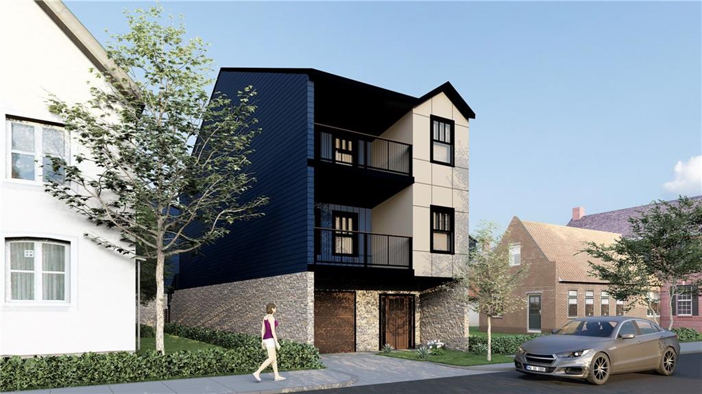 a front view of a residential apartment building with a yard