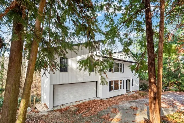 front view of a house with a tree