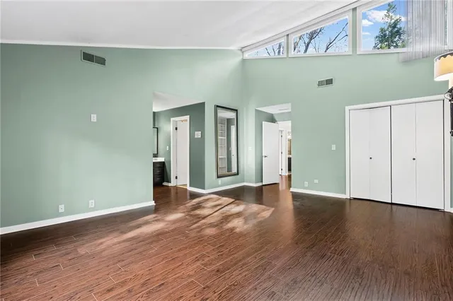 a view of walk in closet with empty racks