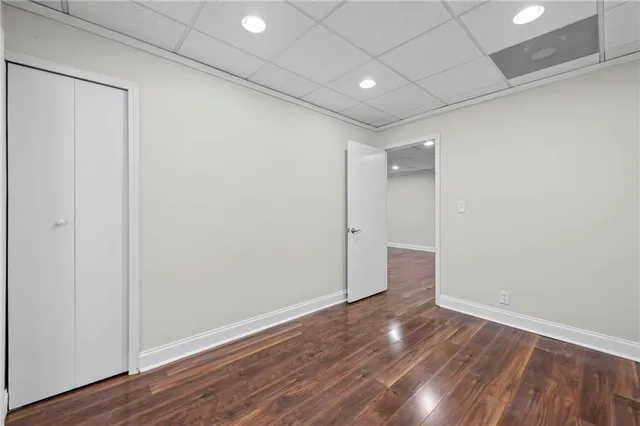 a view of balcony with wooden floor