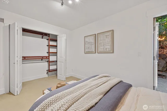 a bedroom with a bed and a closet