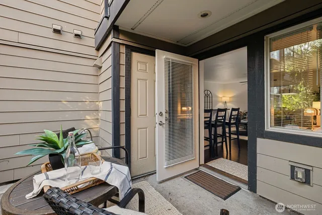 a balcony with furniture and potted plant