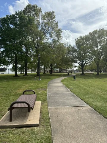 a view of a garden with lawn chairs