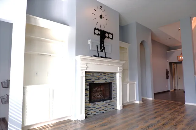 a living room with furniture and a fireplace