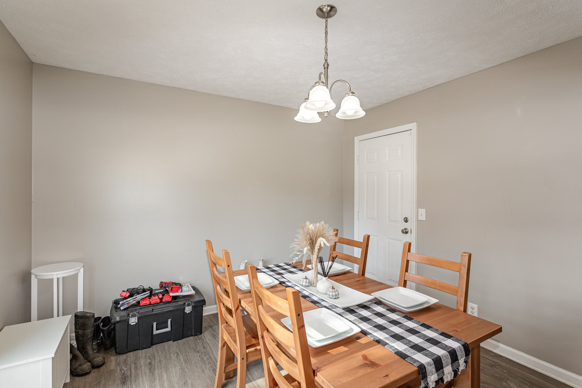 538 Old Highway 70 White Bluff, TN 37187 - Photo 11 of 29 a view of a dining room with furniture wooden floor and a chandelier