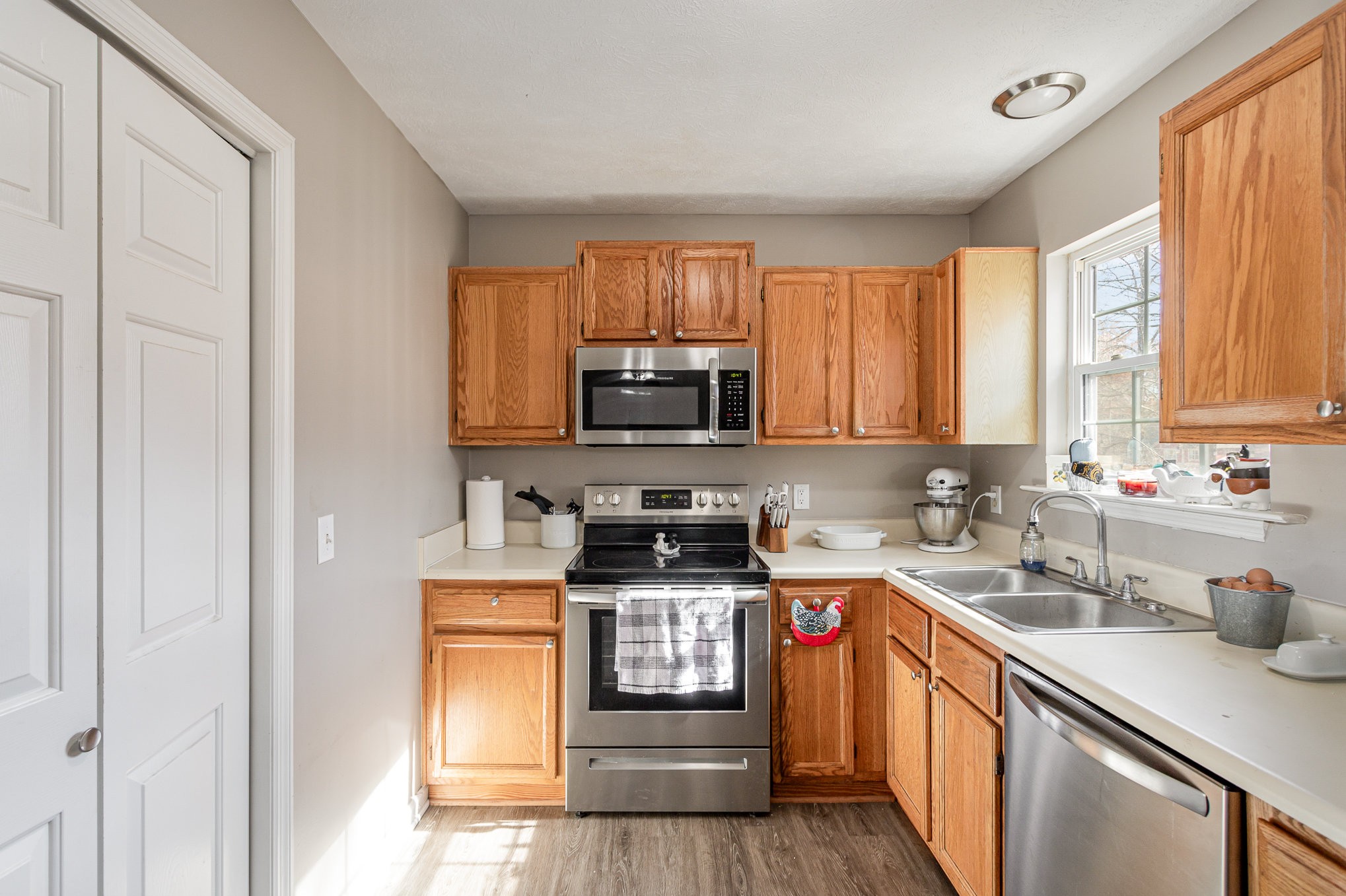 538 Old Highway 70 White Bluff, TN 37187 - Photo 13 of 29 a kitchen with stainless steel appliances granite countertop a stove a sink and a microwave