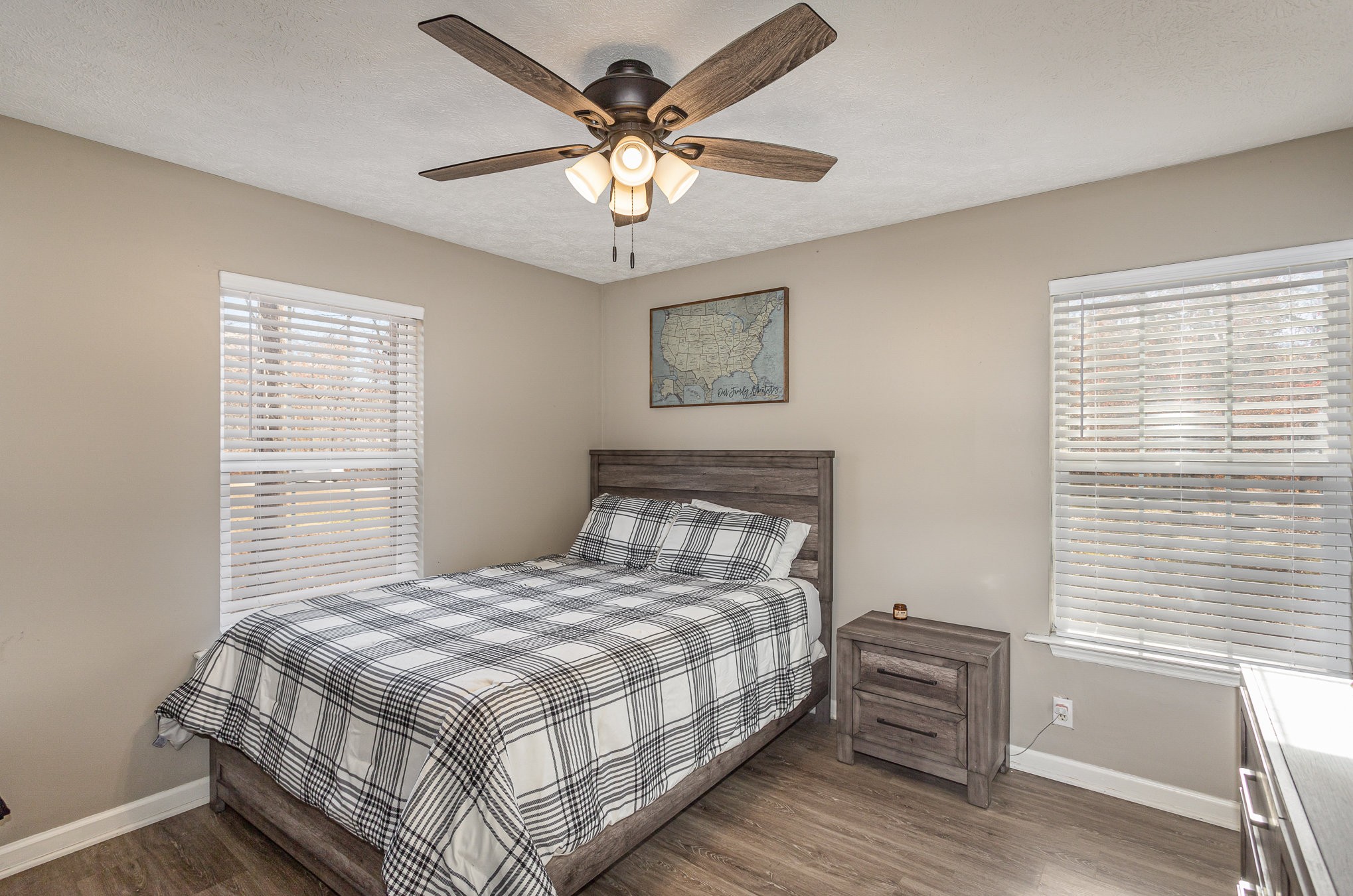 538 Old Highway 70 White Bluff, TN 37187 - Photo 16 of 29 a bedroom with a large bed and a chandelier