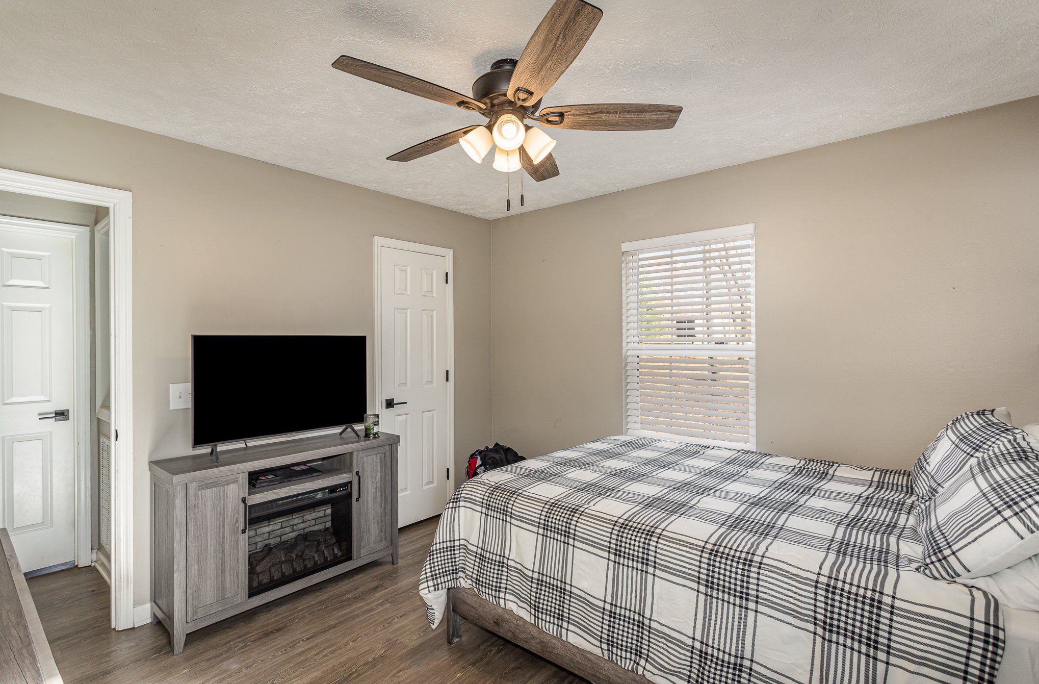 538 Old Highway 70 White Bluff, TN 37187 - Photo 18 of 29 a bedroom with a bed and a flat screen tv