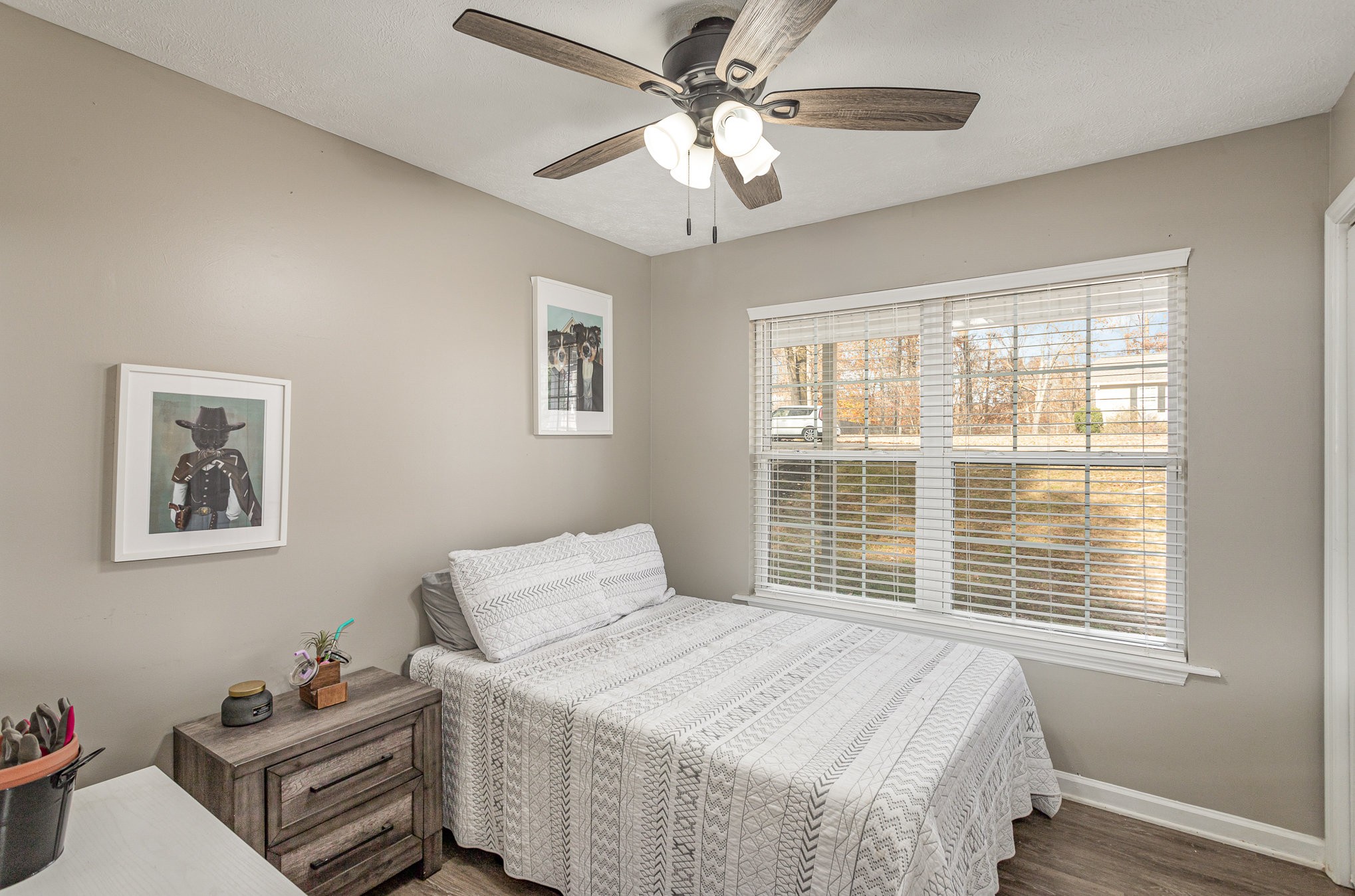 538 Old Highway 70 White Bluff, TN 37187 - Photo 22 of 29 a bedroom with a bed and a chandelier
