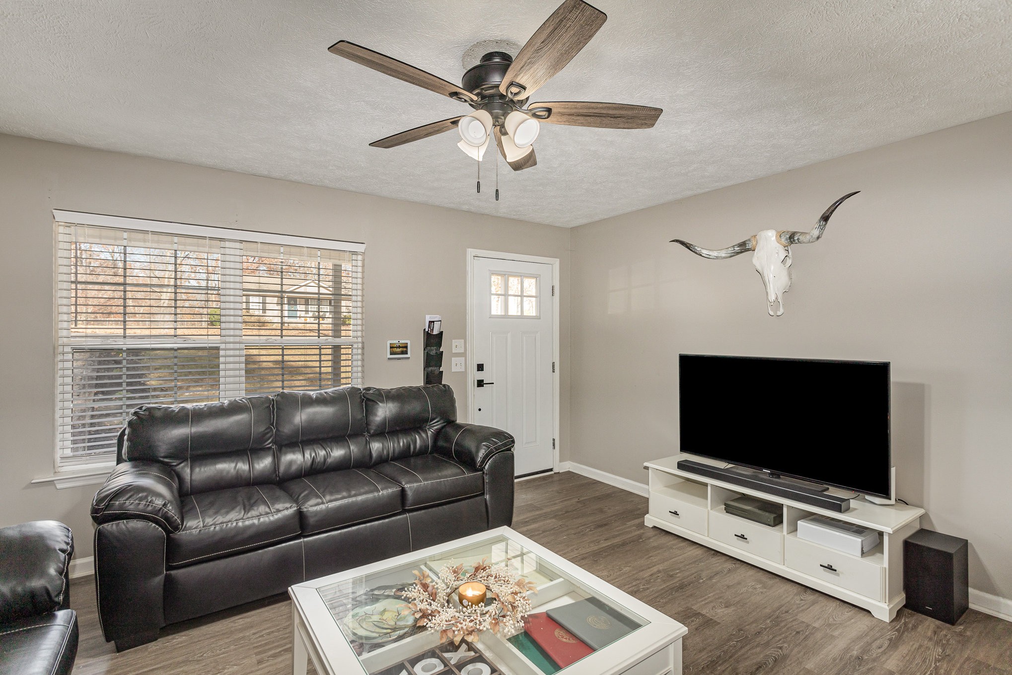 538 Old Highway 70 White Bluff, TN 37187 - Photo 7 of 29 a living room with furniture and a flat screen tv