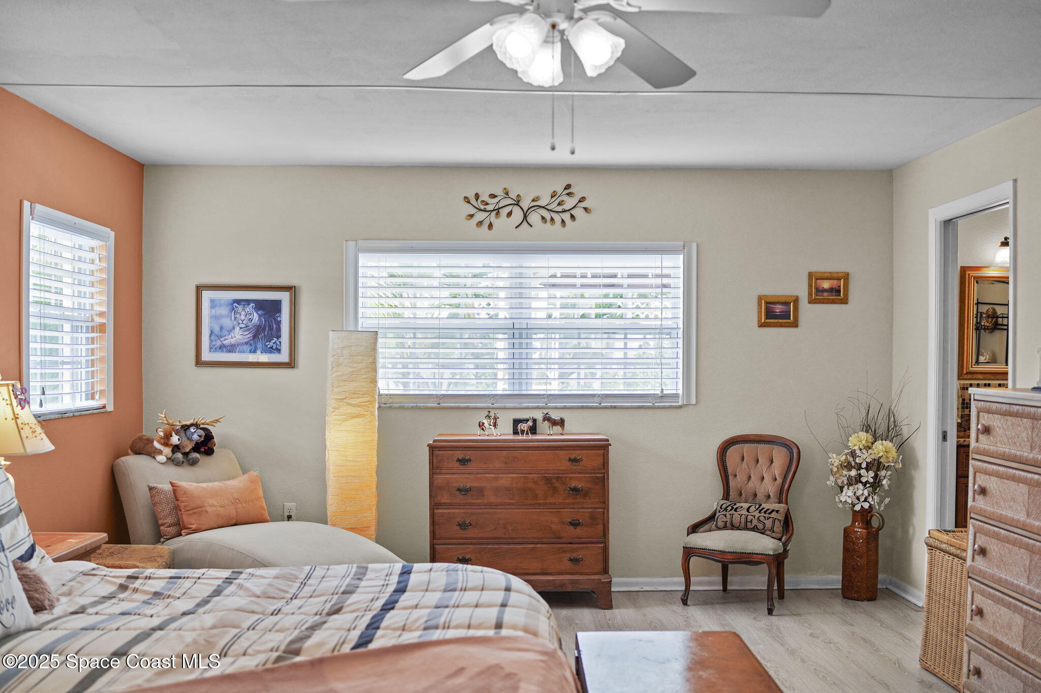 663 Bermuda Road Cocoa Beach, FL 32931 - Photo 19 of 51 a bedroom with a bed and furniture