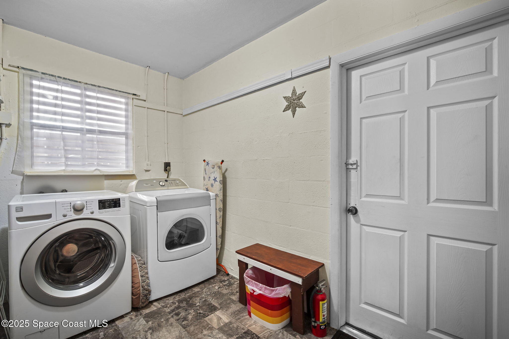 663 Bermuda Road Cocoa Beach, FL 32931 - Photo 27 of 51 a utility room with dryer and washer