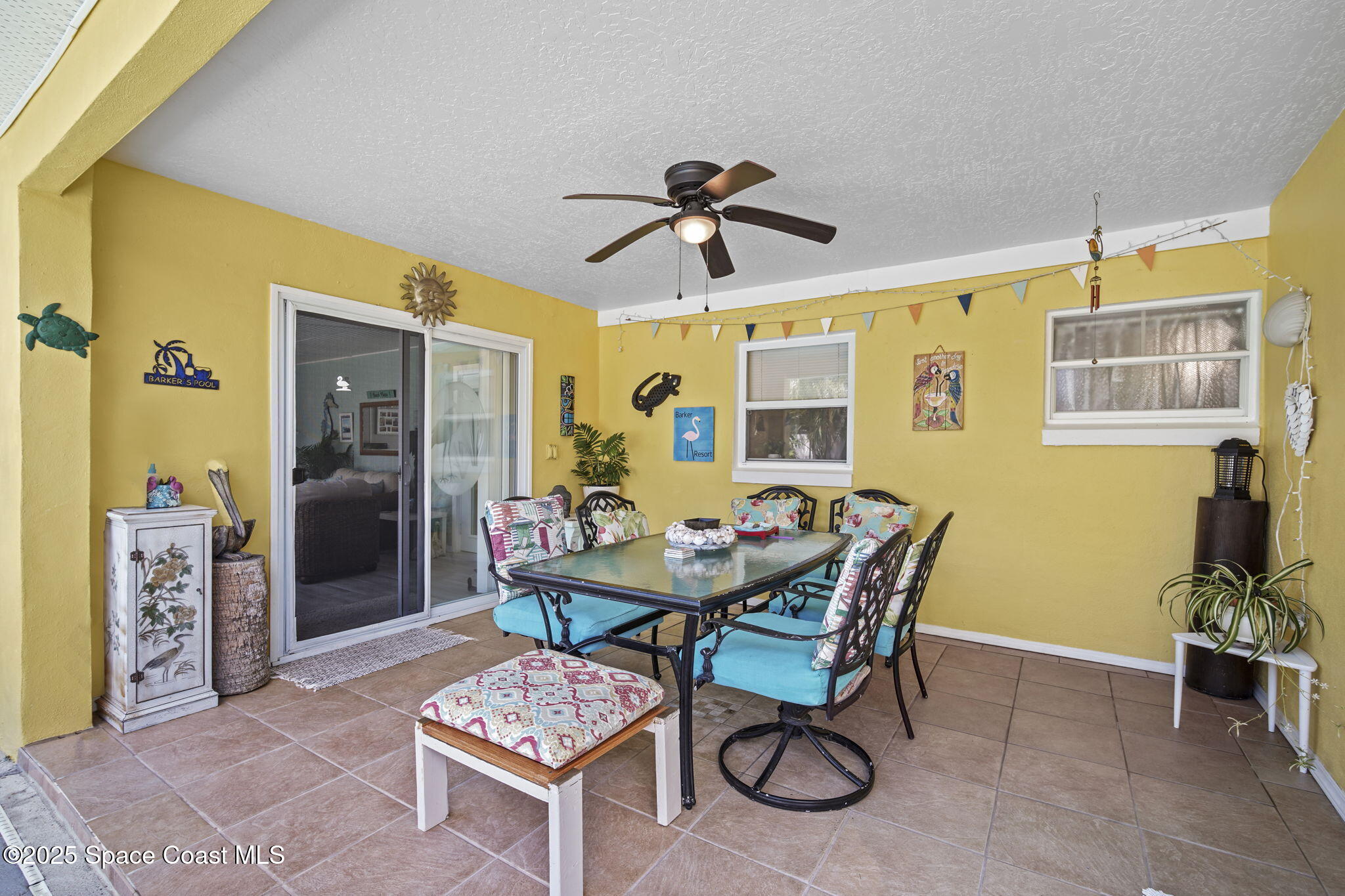 663 Bermuda Road Cocoa Beach, FL 32931 - Photo 28 of 51 a dining room with furniture and window