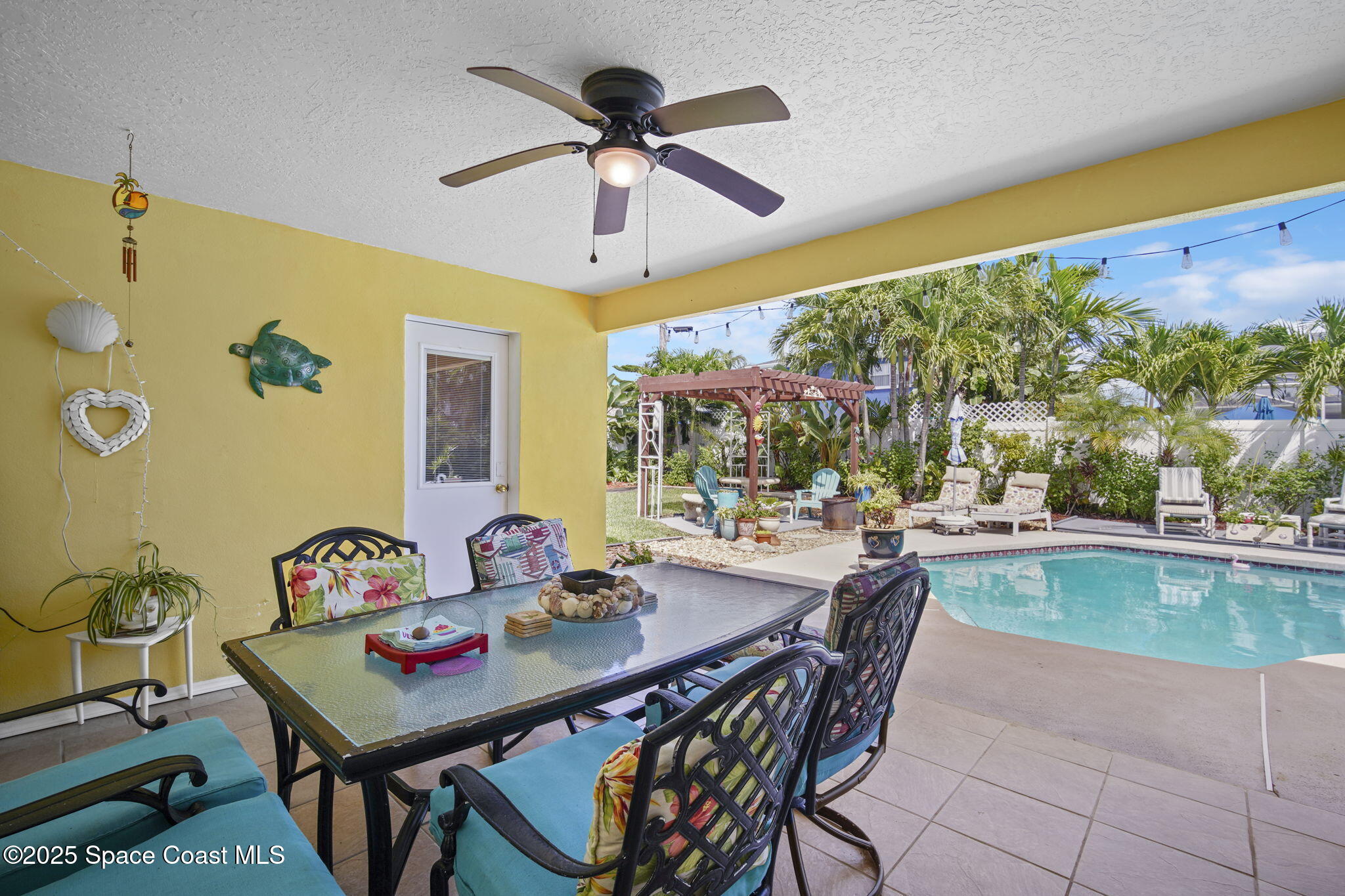 663 Bermuda Road Cocoa Beach, FL 32931 - Photo 29 of 51 a view of a dining room with furniture window and outside view