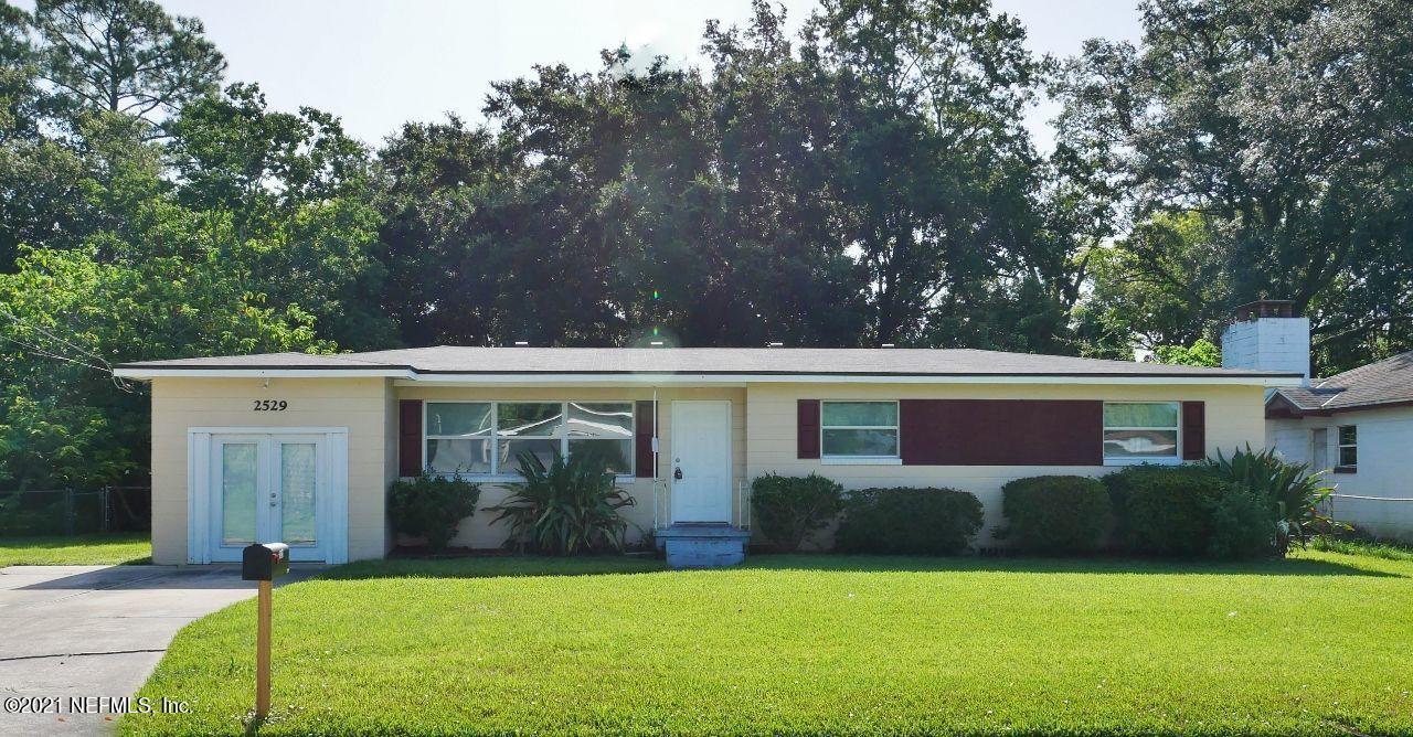 2529 Randy Road Jacksonville, FL 32216 - Photo 1 of 1 a view of house with backyard outdoor seating and green space